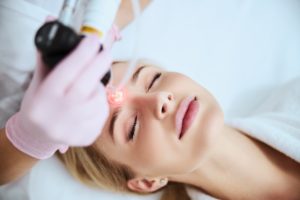 Woman Taking Laser Skin Resurfacing Treatment | Bare N Beautiful in Anderson, SC